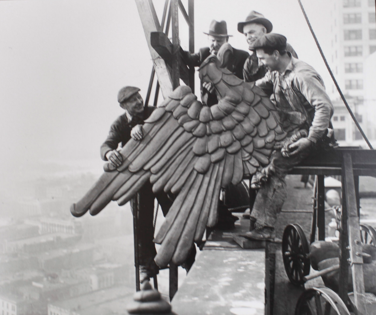 Workmen adjust the eagle ornament atop the City-County Building, Seattle, March 7, 1937