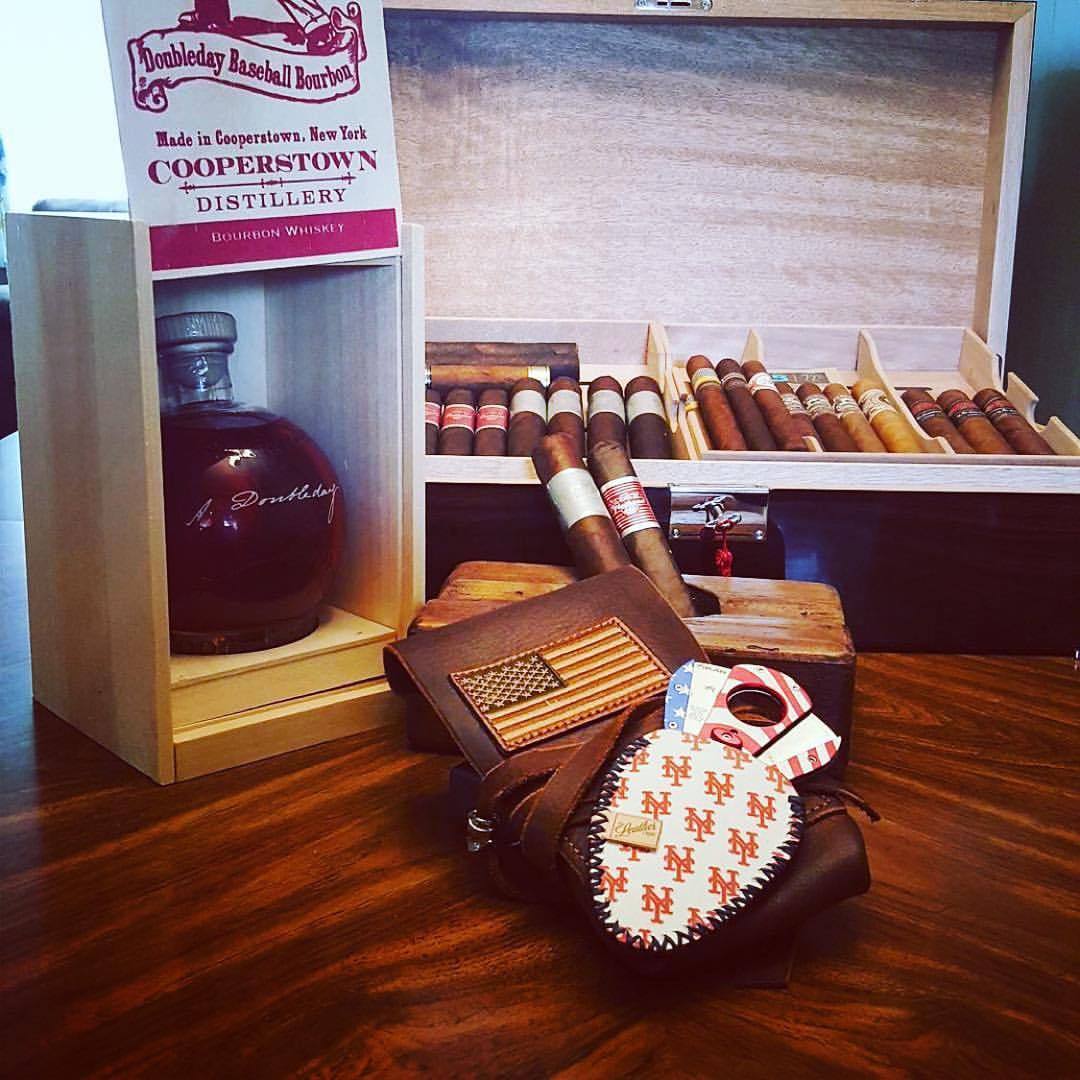 #originaldesign Cigar leather available with flag patches too. Repost from @eddiev143 Got the coolest bottle from my family for my birthday. 7 days till pitchers,and catchers report. @legendarysaxon @theleatherciar @xikar #cigar #cigars...