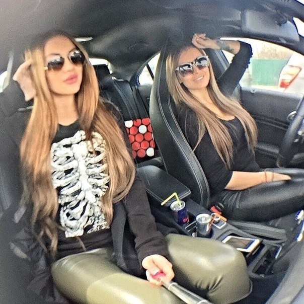 2 sexy girls in car wearing both wetlookleggings