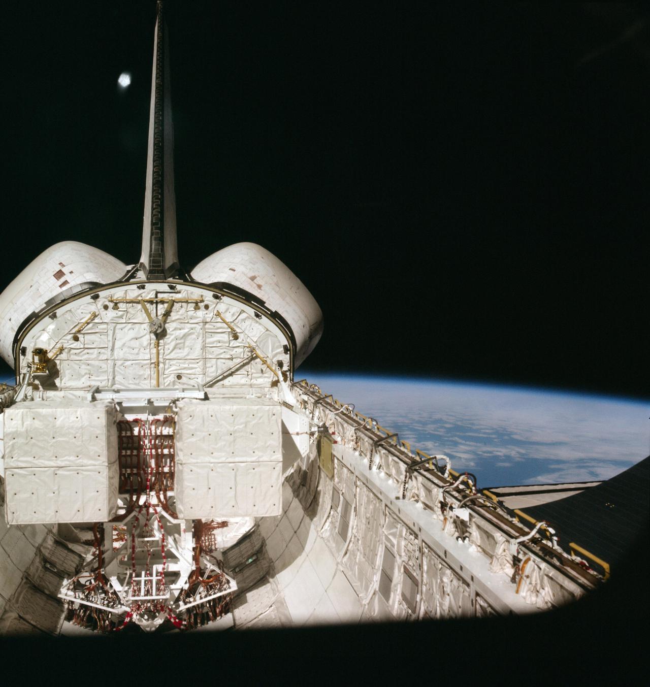 photos-of-space:
“Space Shuttle Columbia during her inaugural orbital mission (STS-1, April 12, 1981). Notice the missing TPS tiles on the OMS pods [4138x4374]
”