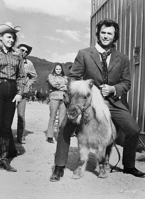 Clint Eastwood rides a rare miniature pony on the set of Joe Kidd -1972.