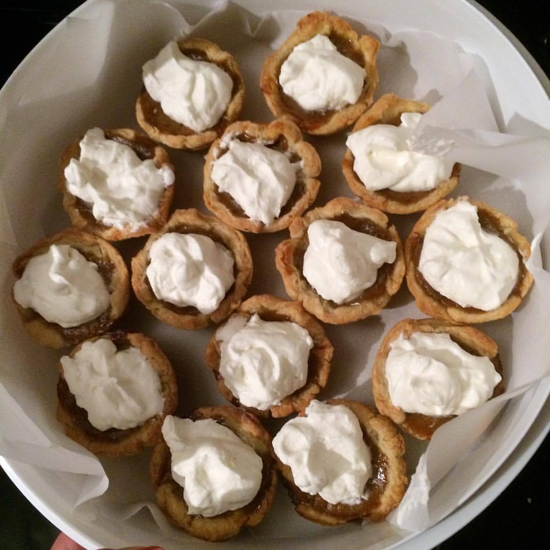 Batgirl is heading to her first Halloween party of the year with mini pumpkin pies topped with fresh whipped cream. #pielove