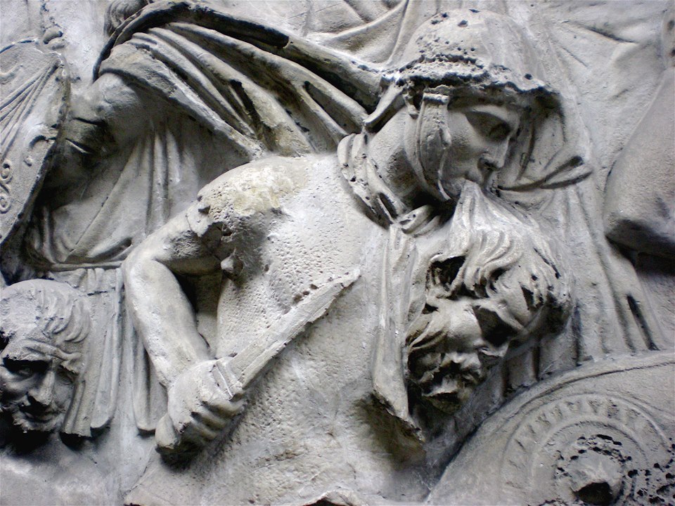 leradr:
“Trajan’s Column. A roman warrior is fighting while is carrying a head of an enemy in the mouth like a trophy
”