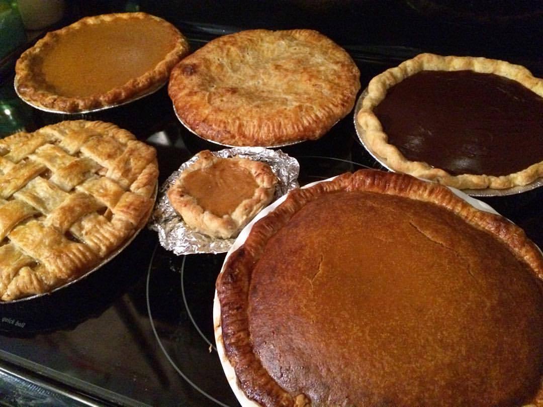 The spoils of today’s baking marathon: cherry, apple, chocolate, and 2.5 pumpkin pies! #thanksgiving #pie