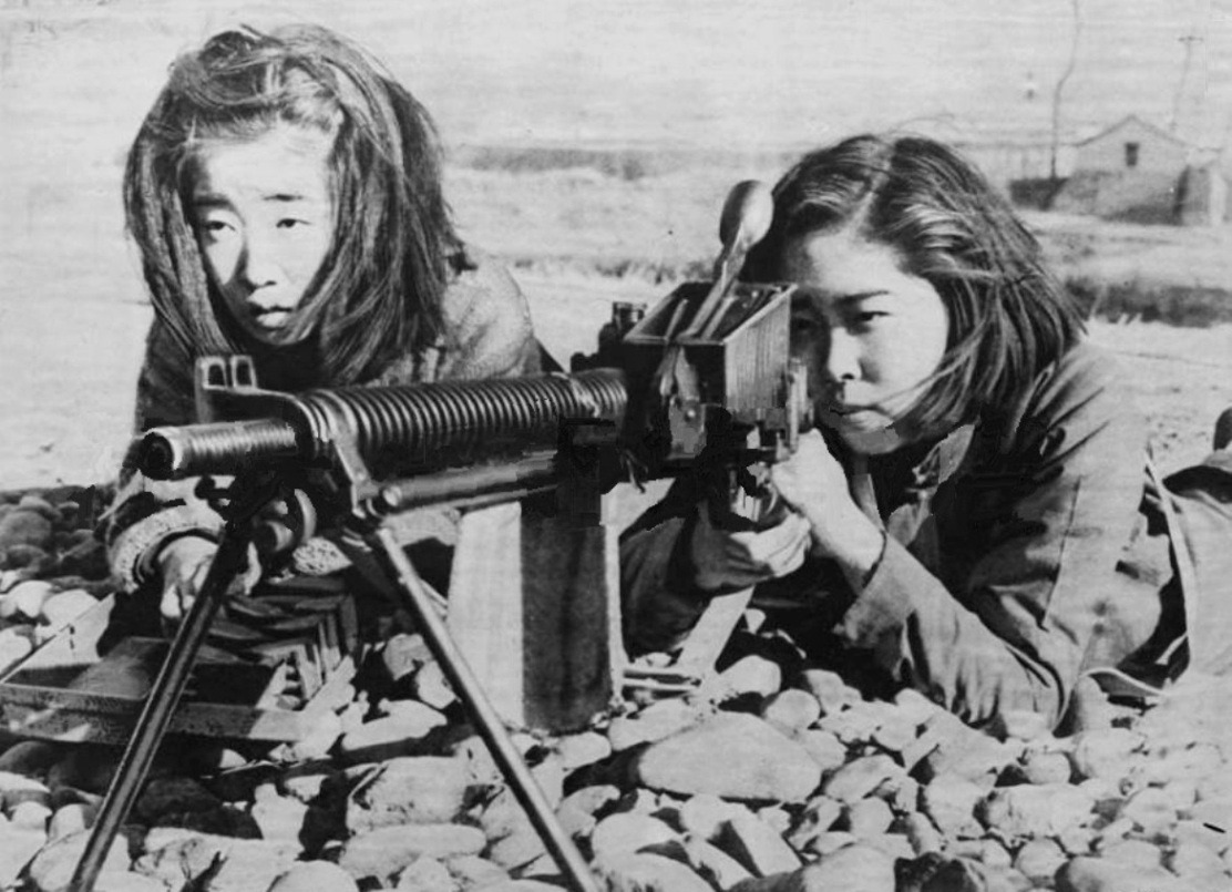 historium:
“Japanese Female Students Training in Gun Handling with a Type 11 Nambu Machine Gun as a last desperate measure to defend the Japanese home islands against the projected Allied invasion in the final stages of World War II. Ryukyu Islands,...