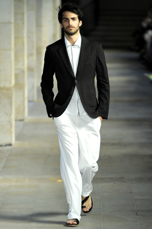 Hermes black two-button suit with white pants and... - The Dapper ...