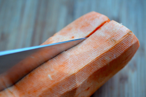 A closeup of a peeled sweet potato cut in half.