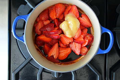 Added honey, vanilla and lemon juice to the pot with the balsamic reduction and sliced strawberries for panna cotta with strawberry balsamic compote.