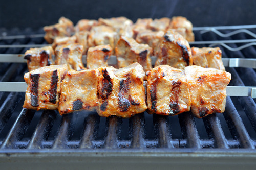 A side view of grilled Peachy Pork-a-Bobs with tasty grill marks.