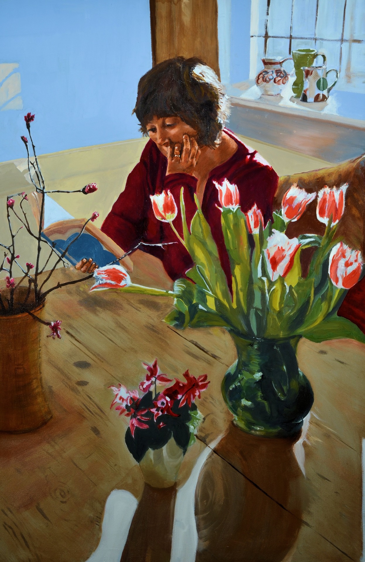This is Helen reading at the kitchen table. It’s an oil painting, I liked the shadows in the room at the time, more work can be seen at www.petedaviesart.com