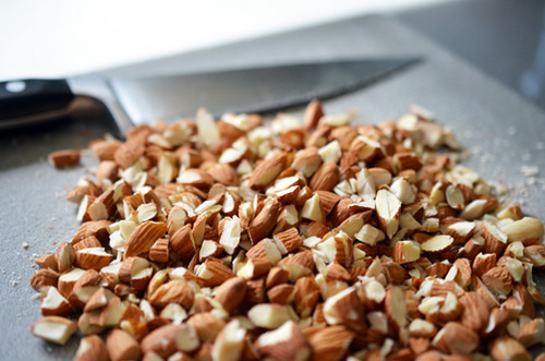 A shot of roughly chopped raw almonds to make Tropical Paleo Granola