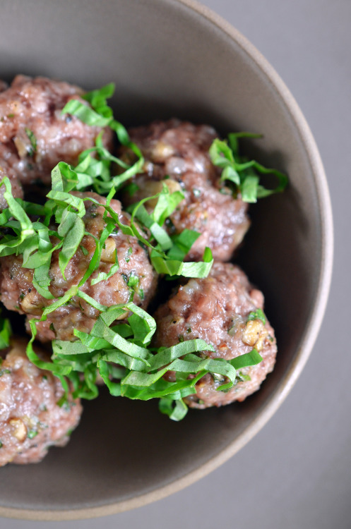 An overhead shot of Lemon Ginger Meatballs topped with basil chiffonade.