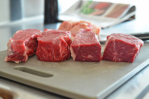 New York boneless strip steaks cut into 4 even pieces.