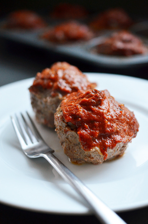 A white plate with two paleo meatloaf muffins on top.