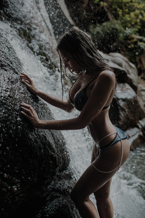 sexy nude girl enjoys a waterfall