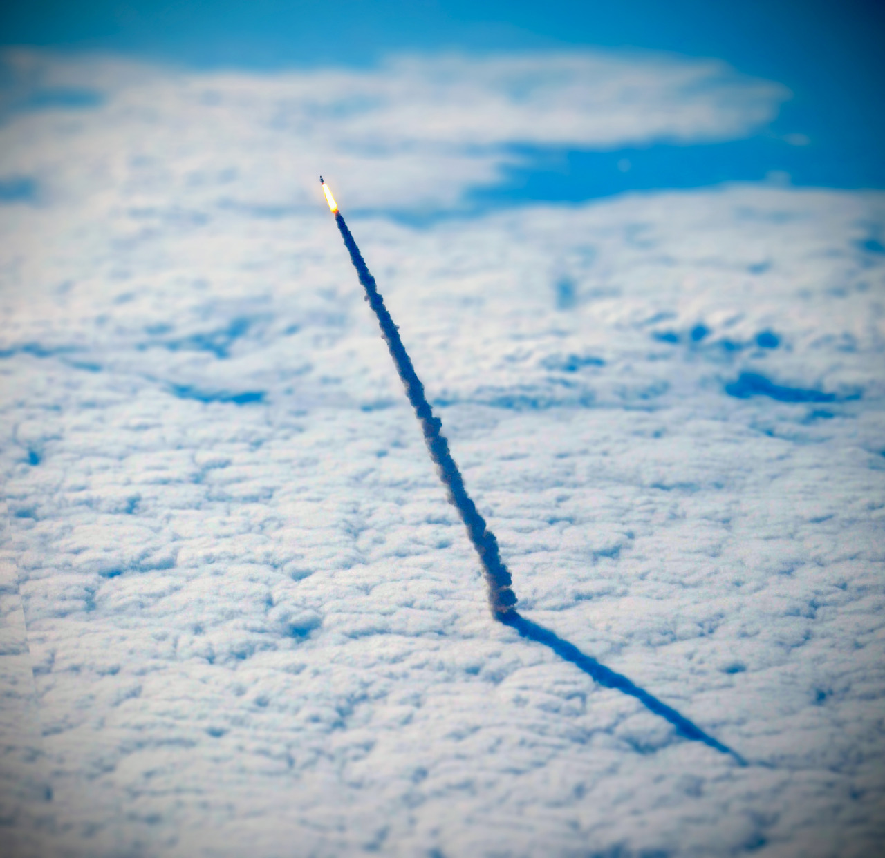 Continuing with our favorite Overviews of 2016, here is an incredible shot we shared in April of the space shuttle Endeavour, lifting through the clouds during its final launch in May 2011. This photograph was captured from a nearby NASA shuttle...