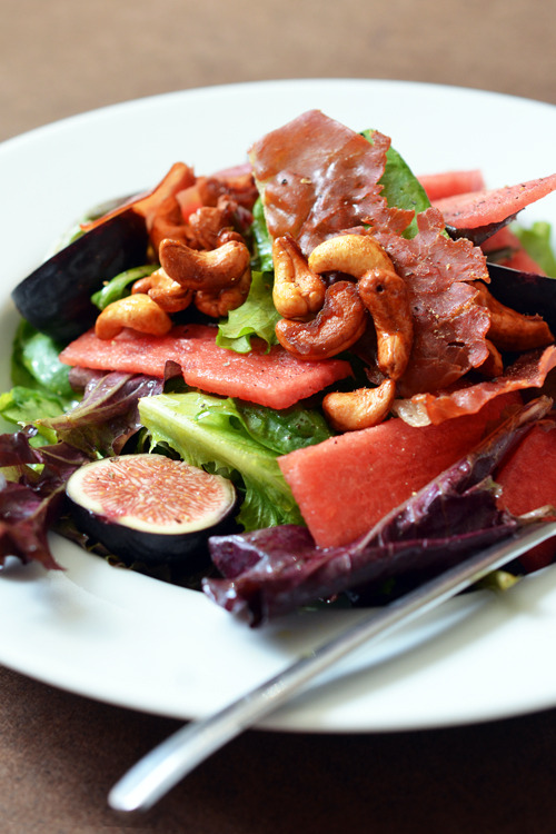 A closeup of a fig and watermelon salad.