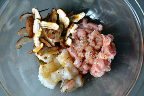 Chicken, shrimp, and mushrooms in a bowl for paleo chawanmushi.