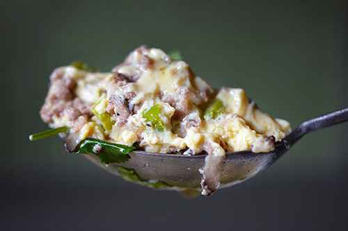 A closeup of a spoonful of Cantonese Egg Custard with Minced Pork 