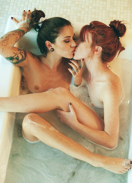 Two lesbians are bathing