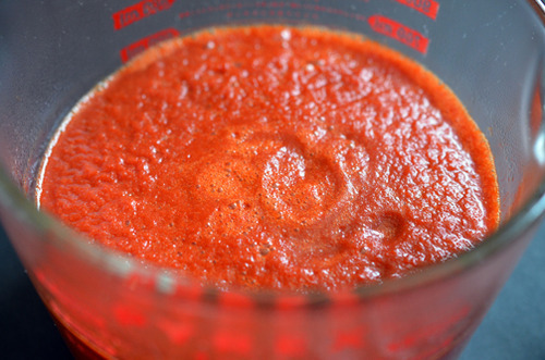 A shot of Whole30® Sriracha in a Pyrex measuring cup.