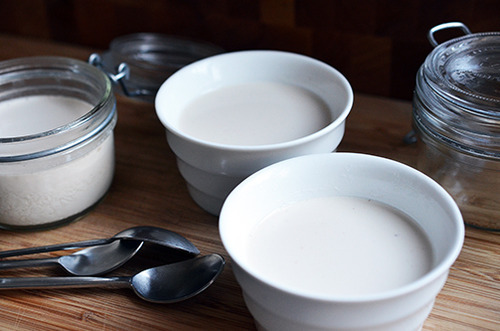 Two bowls of chilled panna cotta mixture.