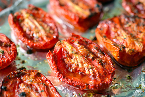 Oven-Roasted Tomatoes on a sheet pan.