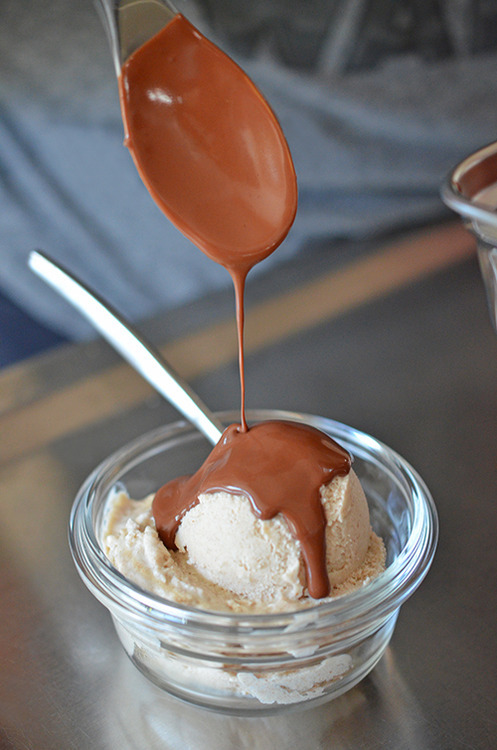 Drizzling paleo chocolate ganache on a scoop of Dairy-Free Vanilla Ice Cream 