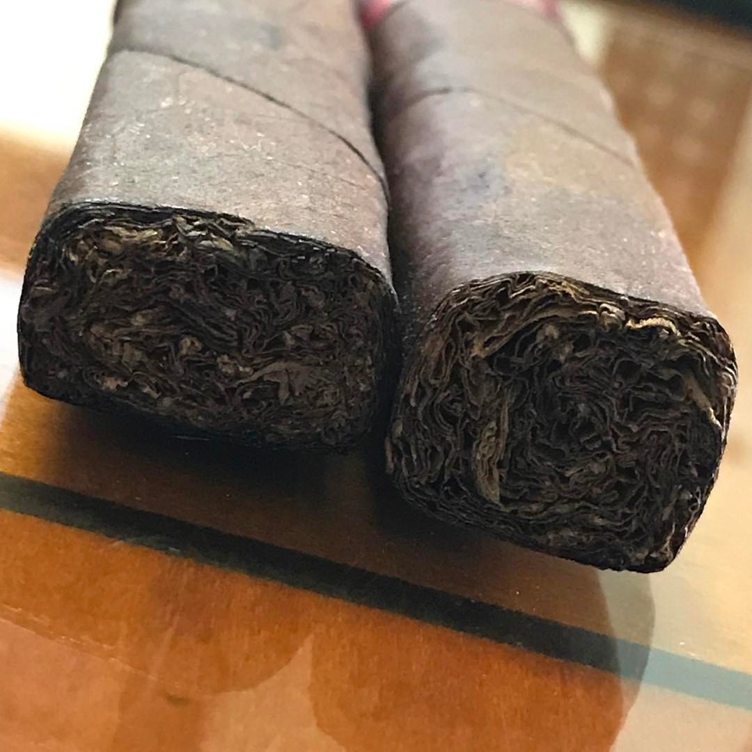 The cigar on the left is how not too press a cigar. The one on the right represents the proper way to box press a cigar so that you have a great draw. Can you tell the difference ? (at Kafie 1901 Cigars)