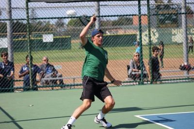 Sophomore Alex Fry receives a ball to help win the point during his doubles match with Han. Costa went into the third round of CIF, but lost against University High School. 