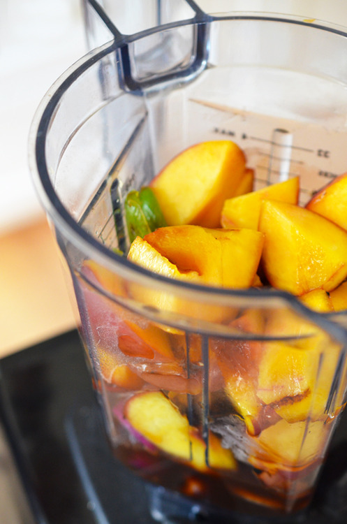 A shot of the Whole30-friendly spicy peach barbecue sauce ingredients in a blender.