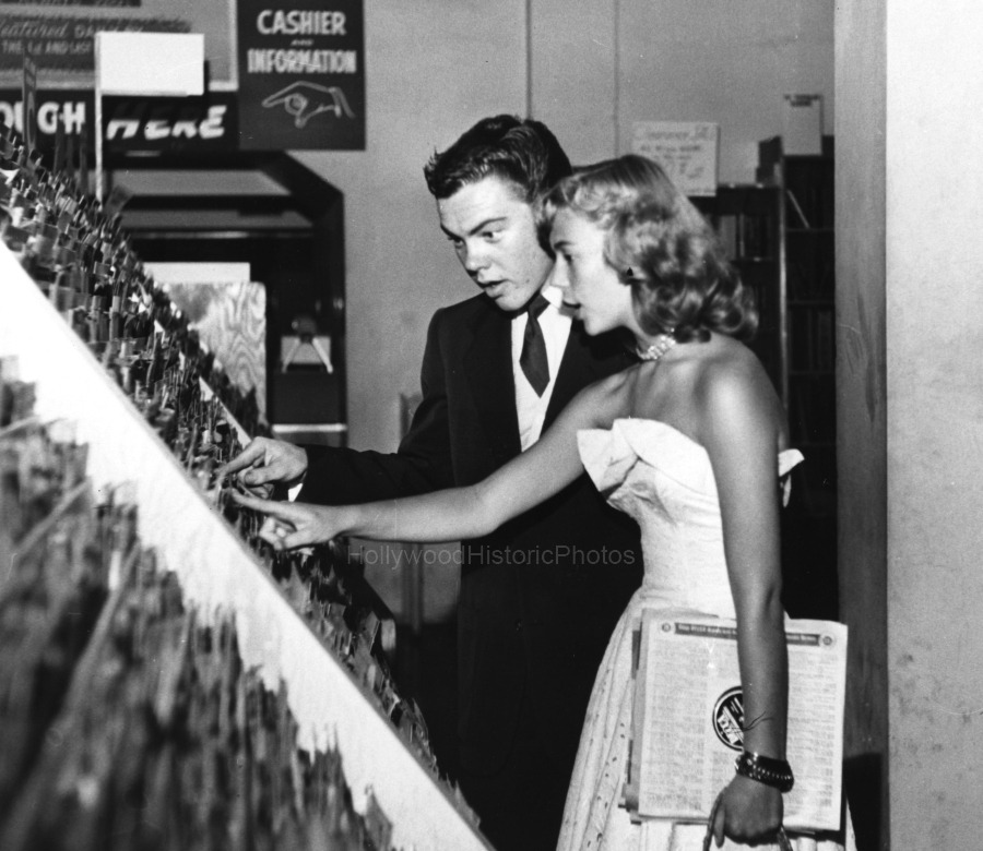 Look look! And here I thought there was no other Bobby picture out there we’d never seen before! This was apparently taken during the “date” he and Natalie Wood went on when he was 17, but didn’t make it into the spread. They’re picking out records...
