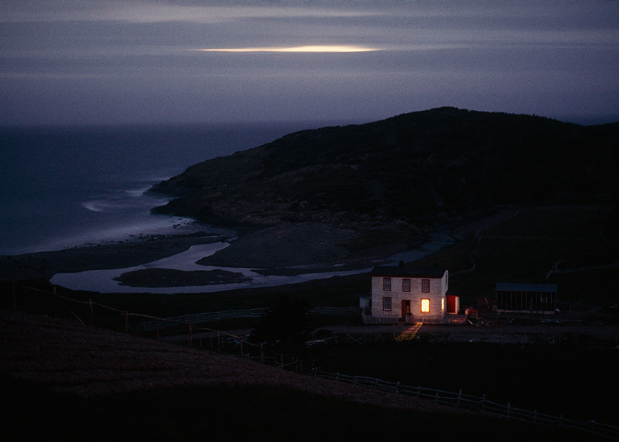 A solitary fisherman’s home keeps watch on quiet Placentia Bay in Newfoundland, Canada, 1974.Photograph by Sam Abell, National Geographic Creative