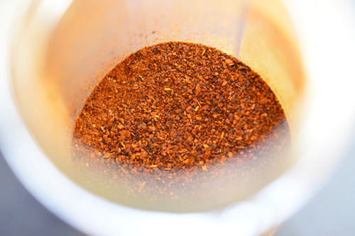Ancho chile powder in a spice bottle.