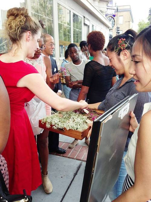 bloompop interns hand out flowers