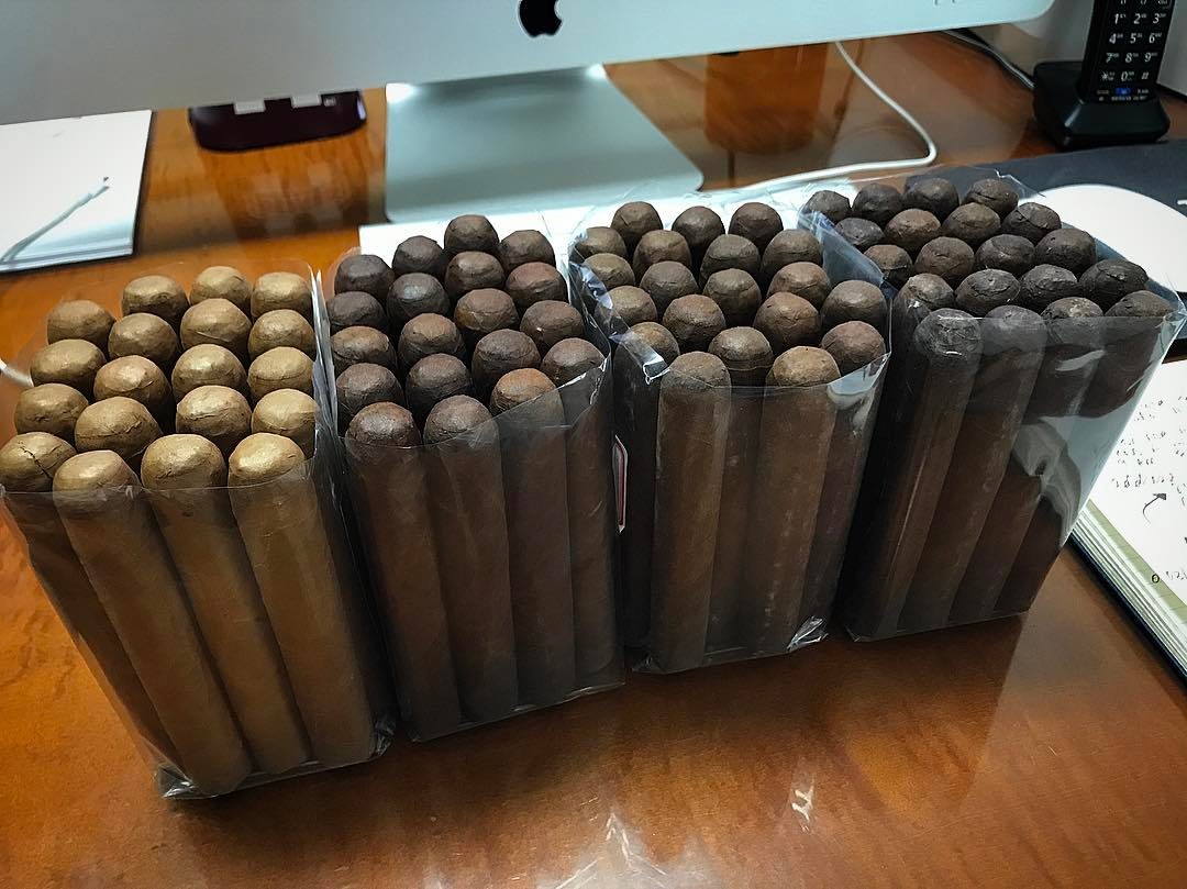 This is what my desk looks like today. I’ve got the task of sampling the 2 month aged cigars coming out of our new factory. They smell and feel superb. #tabacaleragkafieycia #kafie1901cigars #blessed #workhard #sacrifice #havefaith (at Kafie 1901...