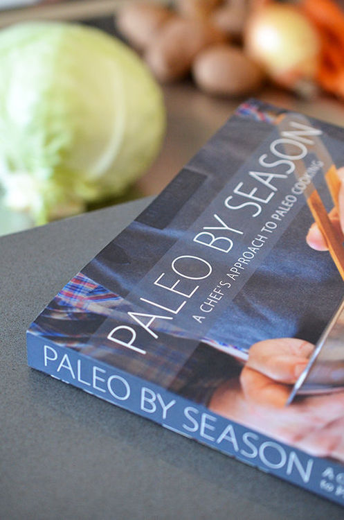 A shot of the cookbook, Paleo By Season, and the vegetables used to make Whole30-friendly Atkilt.