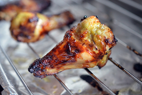 A chili lime chicken on a wire rack baked and cooling.