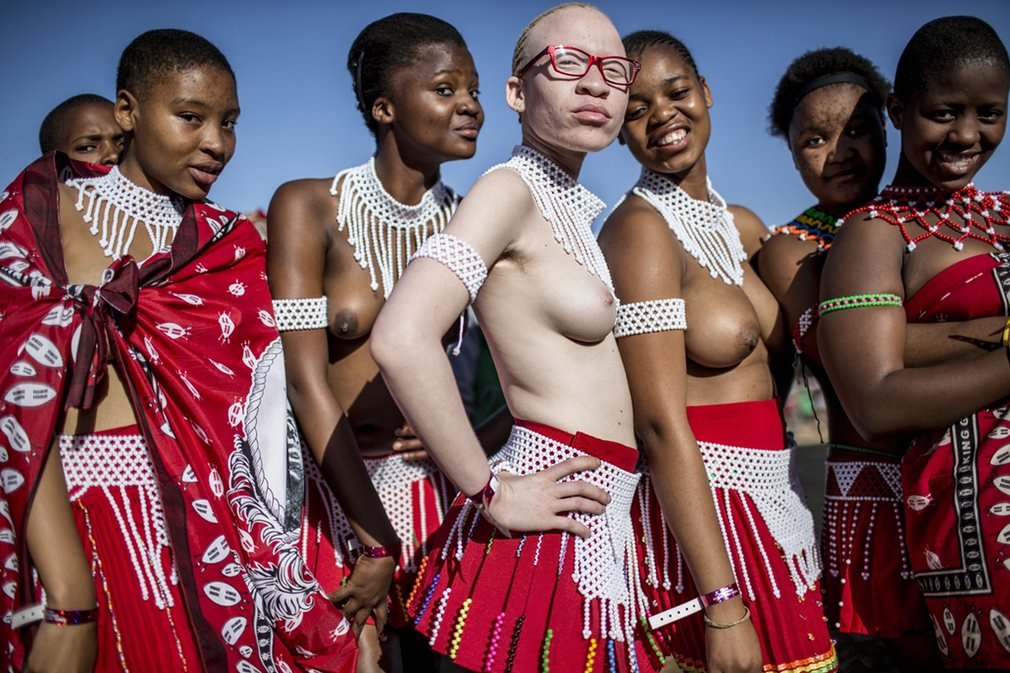 Zulu women at the reed dance. Via The Guardian.
“ An albino ‘maiden’ poses with others, bare-breasted as the tradition requires, in advance of the ceremony.
”