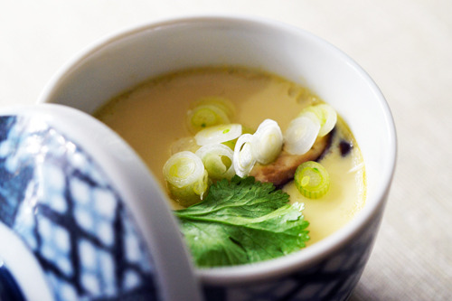 A bowl of paleo chawanmushi topped with green onions and cilantro.