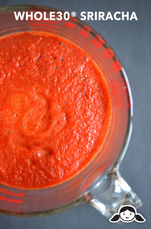 An overhead shot of Whole30® Sriracha in a Pyrex measuring cup.