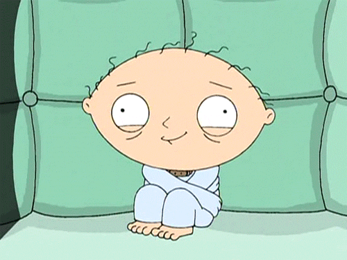 Gif of Stewie from the TV series, "The Family Guy," wearing a straitjacket in a padded room. He is shaking and blinking with unfocused eyes