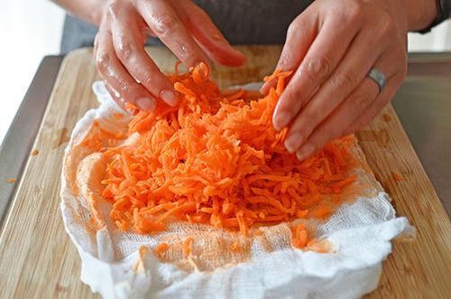 A closeup of the squeezed out grated carrots for Paleo Pumpkin and Carrot Muffins  