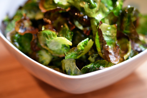 A bowl of Brussels sprouts chips.