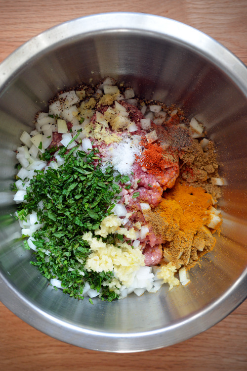 Assembled ingredients for lamb dosas in a metal bowl.