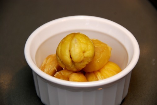 Paleo and Whole30 peeled and roasted chestnuts sitting in a ramekin.