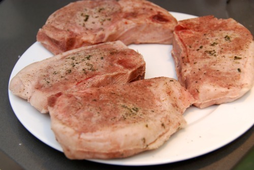 Paleo and Whole30 sous vide pork chops sitting on a plate.