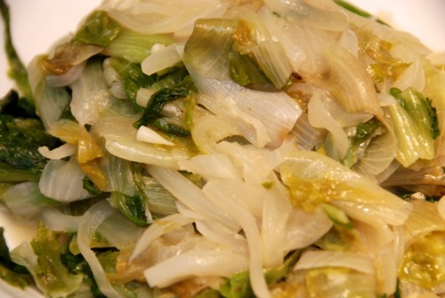 Paleo and Whole30 braised escarole with onions on a plate.
