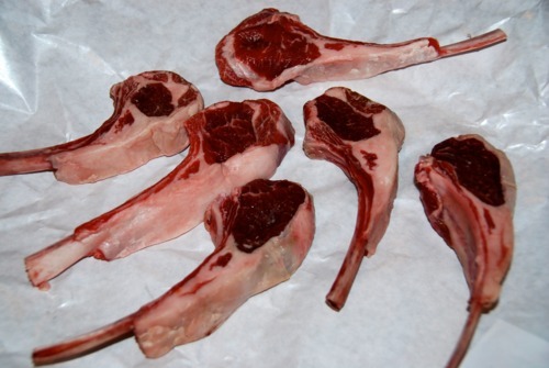 Six lamb chops sitting in butcher paper.