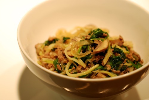 A bowl filled with the paleo approved stir fried kelp noodles with ground beef, broccoli slaw, and spinach recipe.
